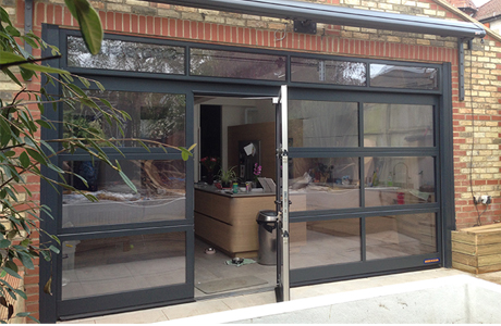 Clear double glazed sectional door with built in pedestrian door for a kitchen